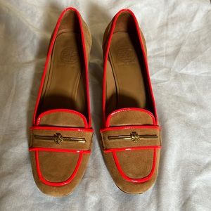 Suede Tory Burch block heel pump with neon orange and brass bar and logo